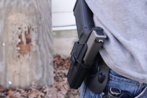 photo-of-a-man-carrying-a-handgun-in-a-holster