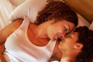 affectionate-lesbian-couple-cuddling-face-to-face-royalty-free-image-1723125900