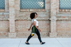 Happy woman walking in the street