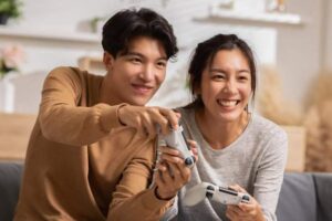 happy-asian-couple-playing-video-games