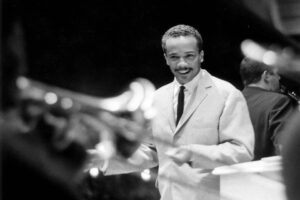 Quincy-Jones-conducting-in-1960.-Born-in-1933-in-south-Chicago-he-won-music-scholarships-and-first-rose-to-prominence-as-a-trumpet-player-in-Lionel-Hamptons-jazz-band-1200x842-1