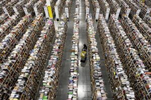 Worker gathers items for delivery at Amazon's distribution center in Phoenix