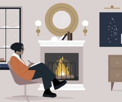 A peaceful moment of introspection, with a woman writing in a notebook while comfortably seated by a crackling fireplace in a well-appointed living room