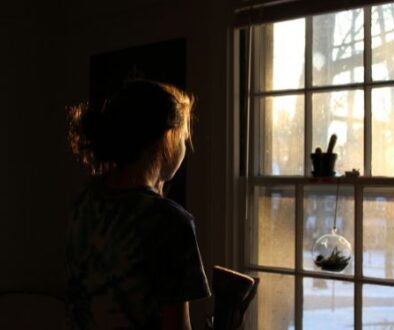 girl-looking-out-window.jpg.optimal