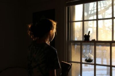 girl-looking-out-window.jpg.optimal