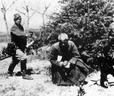 ajapanese-officer-prepares-to-shoot-a-buddhist-monk-and-a-v0-sk7uvxvd317g1