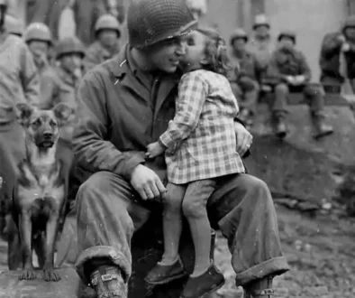 wwii-american-soldier-with-local-french-child-europe-1945-v0-did3a04nrm5g1