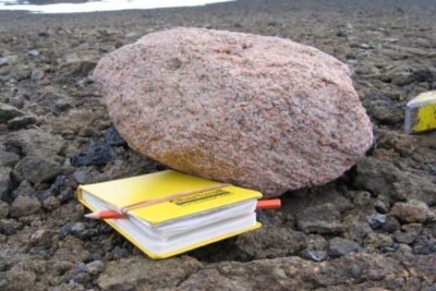 Pink-Granite-Boulder-Next-to-a-Yellow-Notebook-777x584-1