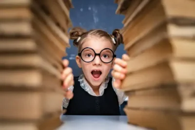 smart-girl-student-with-glasses-stacks-of-books