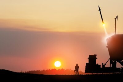 How do Israel and Iran’s nuclear status differ under international law?