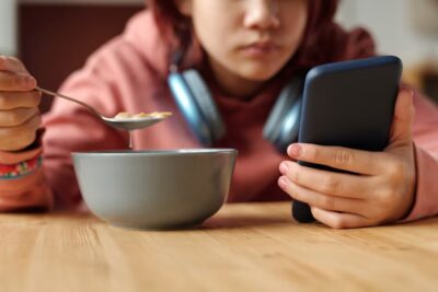 Parents are on devices during meals even more than their kids. Here’s how to rethink family dinner